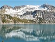 Rakousko - Lünersee, hladina odráží horské štíty kolem
